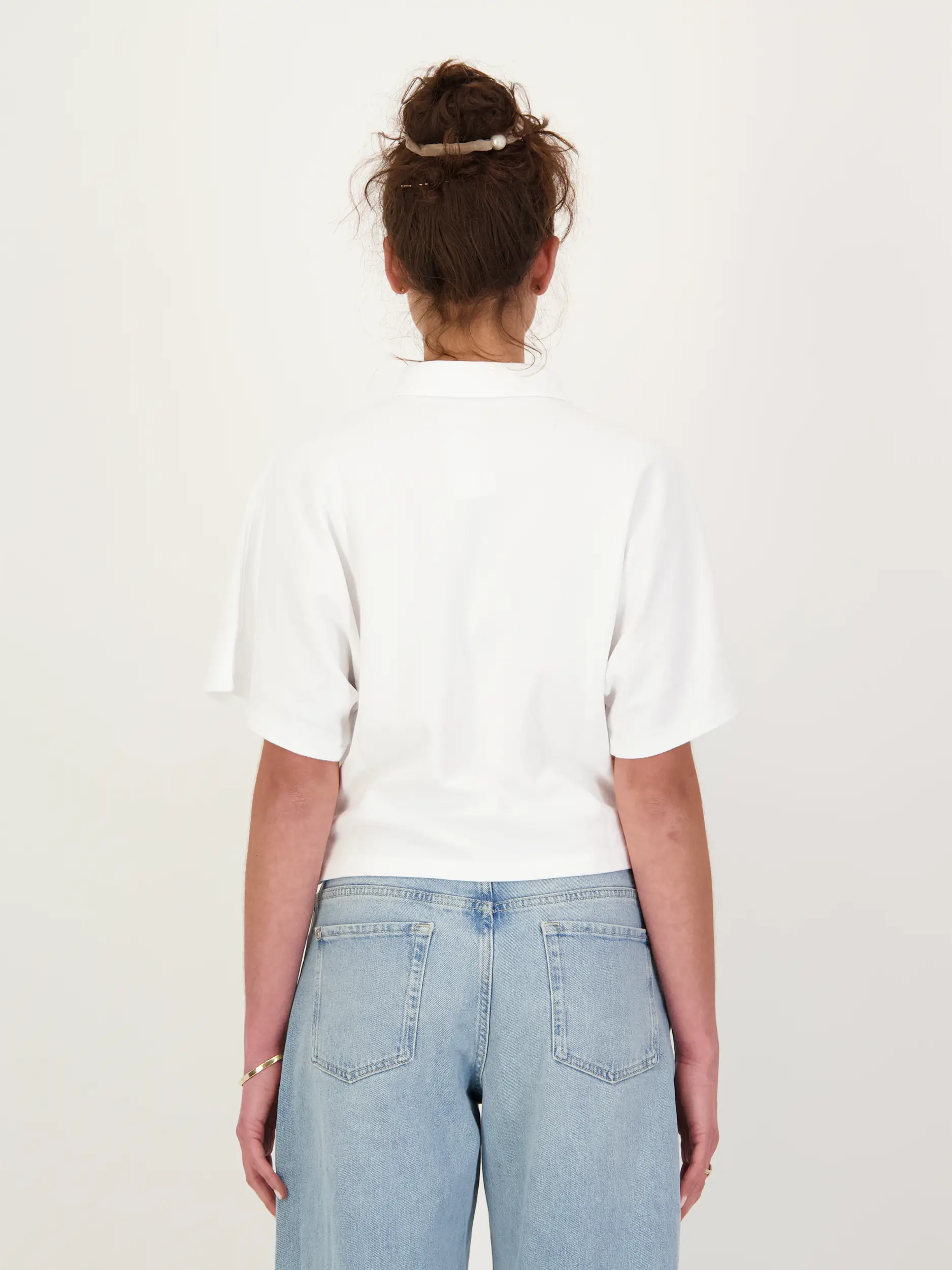 Poloshirt 3/4 Arm - Artikel Rückseite getragen von einem Modell - Farbe: Weiß