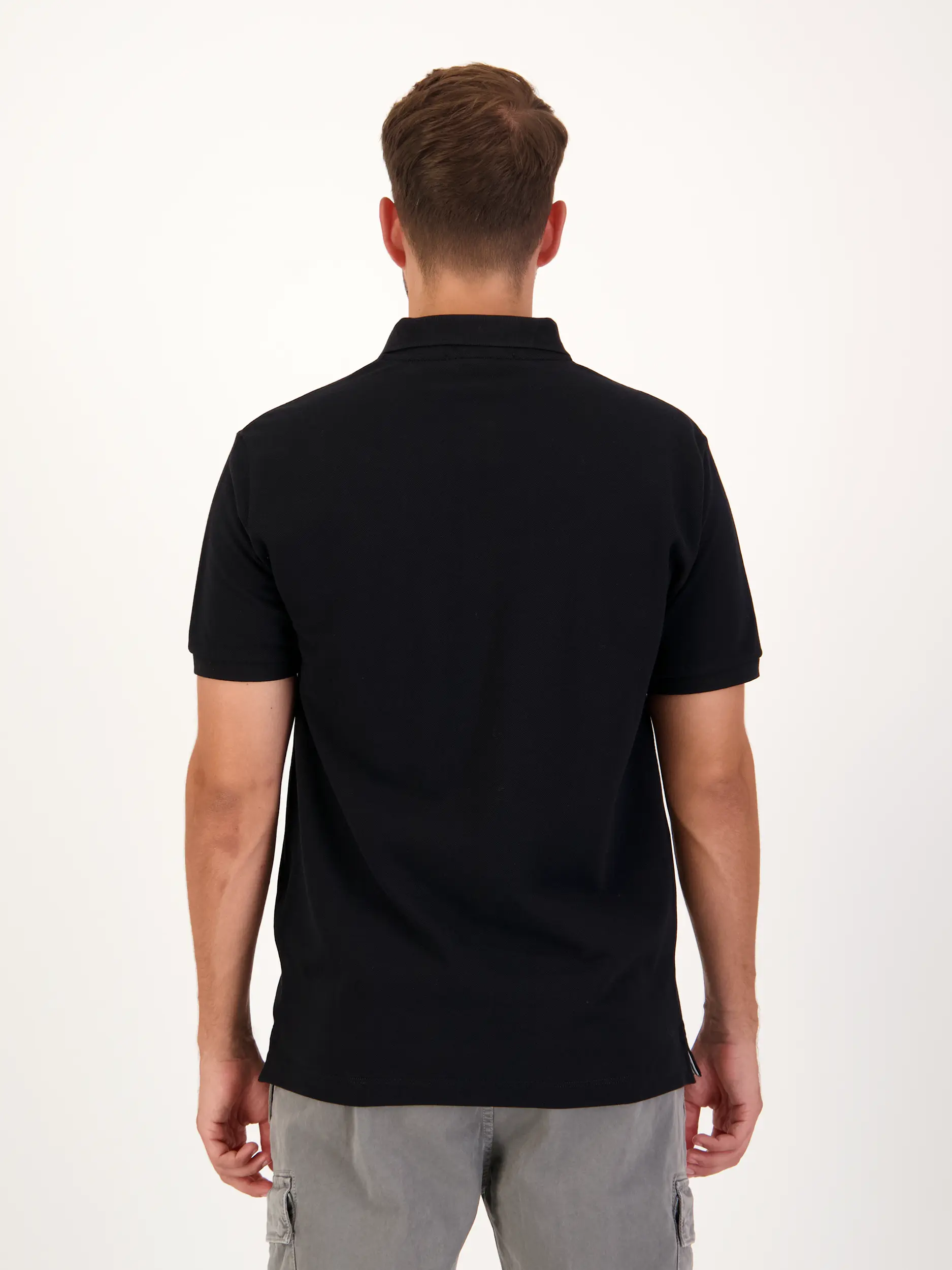 Poloshirt - Artikel Rückseite getragen von einem Modell - Farbe: Schwarz